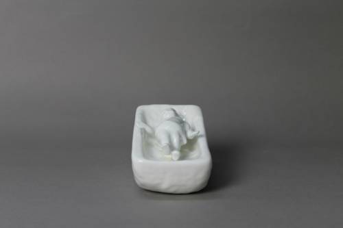 Crib. Large, white glazed figure.