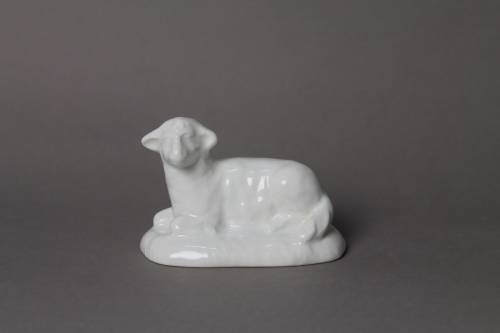 Lying sheep. Large, white glazed figure.