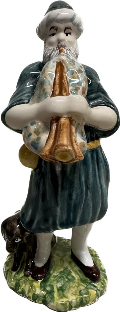 Shepherd with bagpipes. Large, coloured figure.