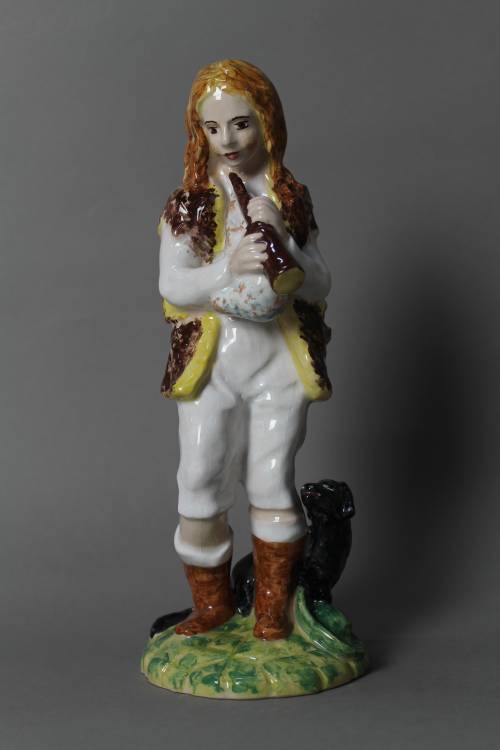 Shepherd with pipe and dog. Large, coloured figure.