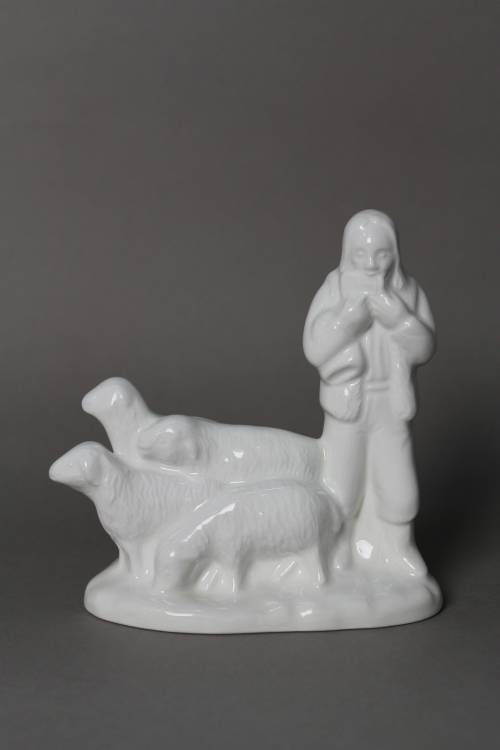 Shepherd with sheep. Small, white glazed figure.