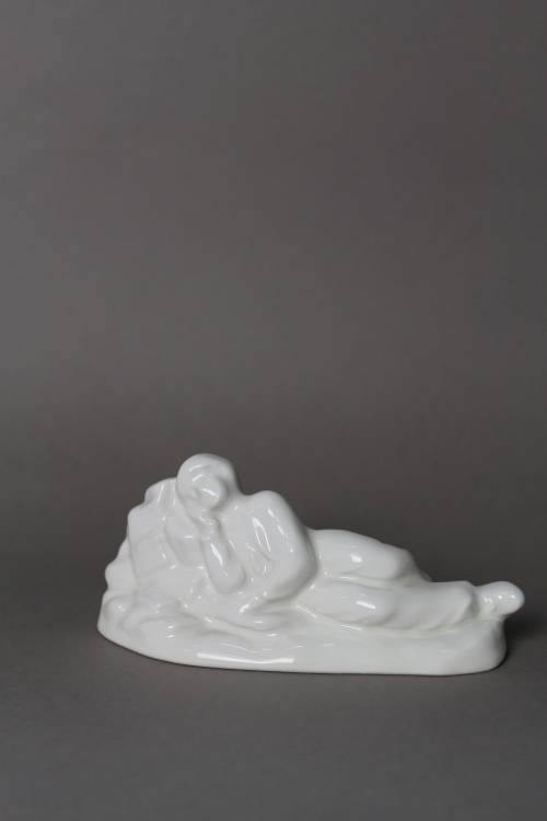 Sleepyhead. Small, white glazed figure.