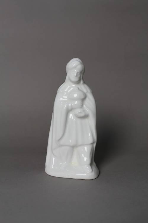 Standing wise man carrying frankincense. Small, white glazed figure.