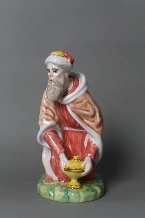 Wise man carrying myrrh (kneeling). Large, coloured figure.