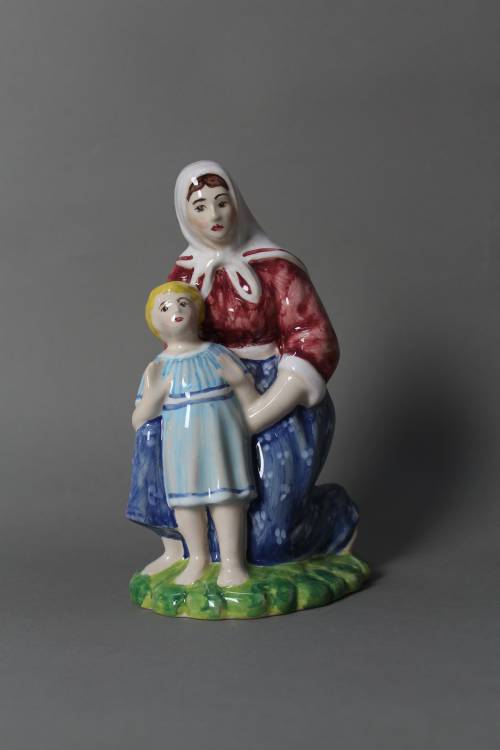 Woman with child. Large, coloured figure.